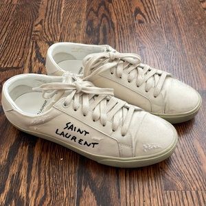 Pre-distressed Saint Laurent sneakers.